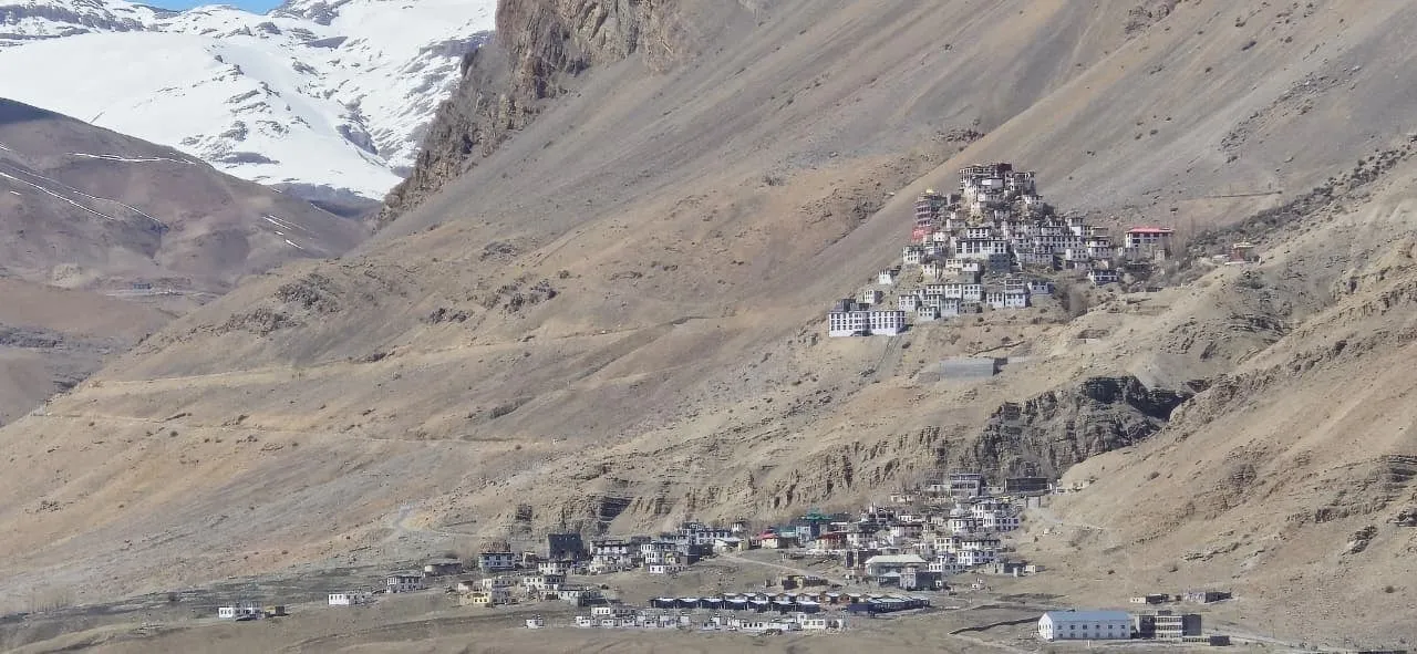 Key Monastery stacked on a hillside above Kee village, with snow peaks behind